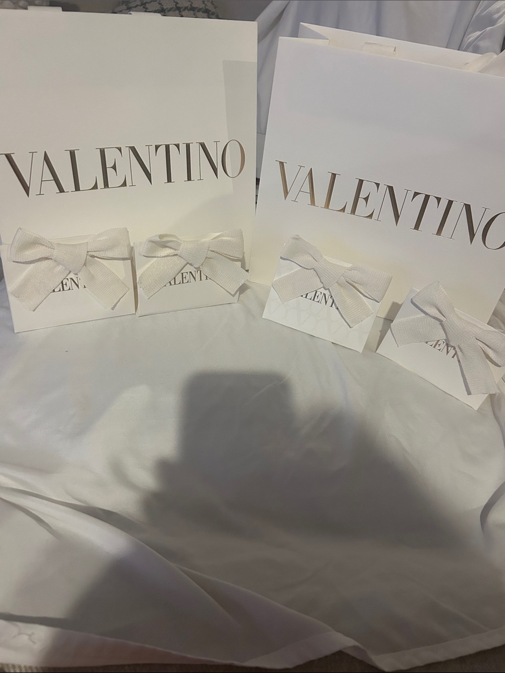 Valentino White Gift Bags and Bow-Adorned Boxes with Gold Logo
